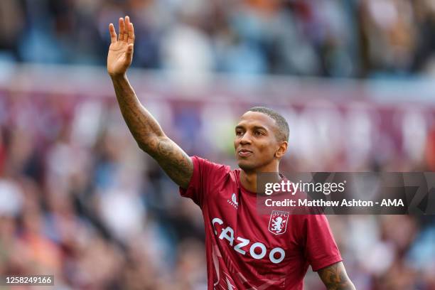 Ashley Young of Aston Villa celebrates qualifying for the UEFA Conference League after the 2-1 victory over Brighton during the Premier League match...