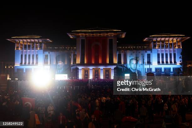 People gather outside the Presidential palace ahead of President Recep Tayyip Erdogan's victory speech after the Turkish presidential election runoff...