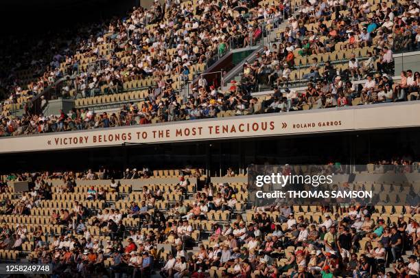 Spectators watch the men's singles match between France's Adrian Mannarino and France's Ugo Humbert on day one of the Roland-Garros Open tennis...