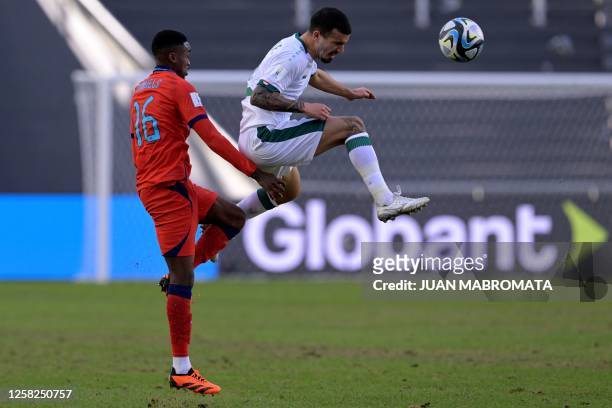 England's defender Imari Samuels and Iraq's defender Alai Ghasem vie for the ball during the Argentina 2023 U-20 World Cup Group E football match...