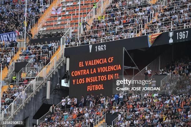 Screen displays the message " Valencia CF against violence and insults in football" during the Spanish league football match between Valencia CF and...