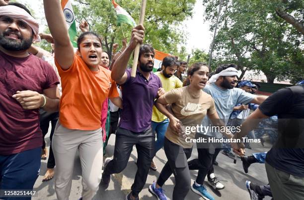 Wrestlers Vinesh Phogat, Bajrang Punia and Sangeeta Phogat during wrestlers' protest march towards new Parliament building, on May 28, 2023 in New...