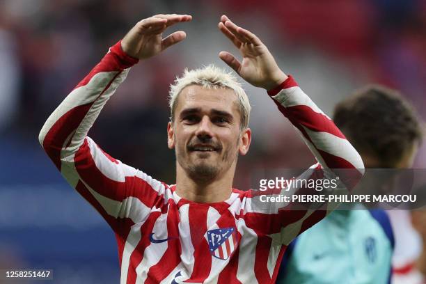 Atletico Madrid's French forward Antoine Griezmann celebrates at the end of the Spanish league football match between Club Atletico de Madrid and...