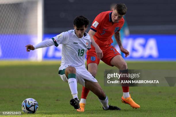 Iraq's midfielder Ali Sadeq and England's midfielder Alfie Devine vie for the ball during the Argentina 2023 U-20 World Cup Group E football match...