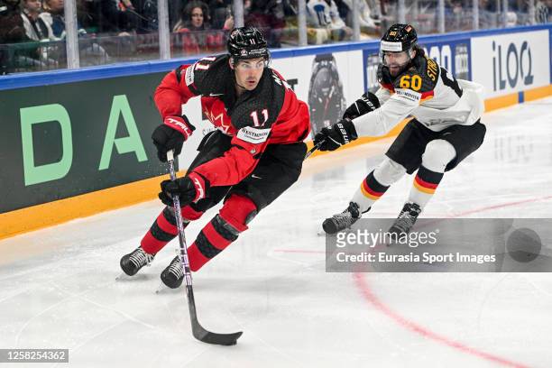 Jack Mcbain of Canada defends the puck against Wojciech Stachowiak of Germany during the 2023 IIHF Ice Hockey World Championship Finland - Latvia...
