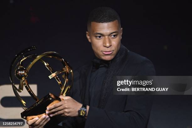 Paris Saint-Germain's French forward Kylian Mbappe delivers a speech after receiving the Best Ligue 1 Player award during the 31th edition of the...