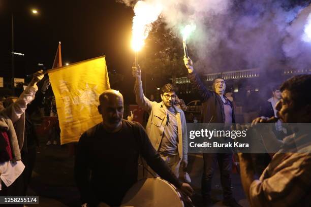 Supporters of Turkish President Recep Tayyip Erdogan celebrate as he claims victory in the Turkish presidential election runoff near the presidential...