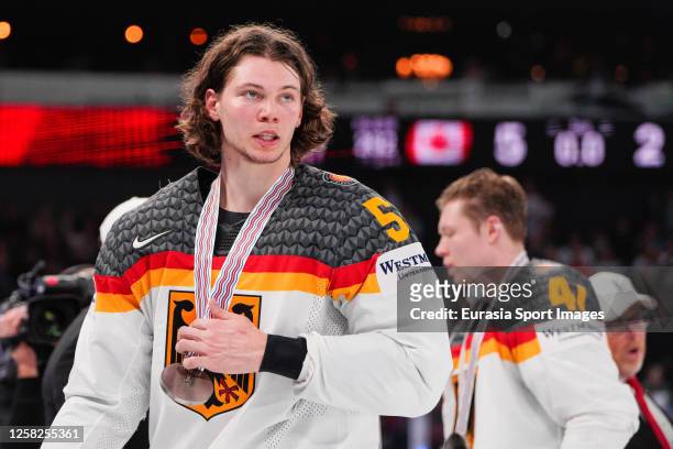 Moritz Seider of Germany with the silver medal during the 2023 IIHF Ice Hockey World Championship Finland - Latvia game between Canada and Germany at...