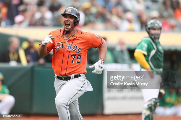 Jose Abreu of the Houston Astros celebrates after hitting a solo home run in the top of the eighth inning against the Oakland Athletics at...