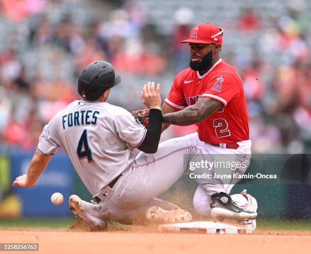 Luis Rengifo of the Los Angeles Angels covers second base as Nick Fortes of the Miami Marlins is safe with a steal in the eighth inning at Angel...