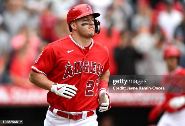 Mike Trout of the Los Angeles Angels shuts his eyes after flying out and leaving two runners on base to end the game in the ninth inning against the...