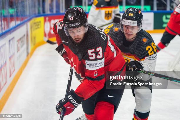 Michael Carcone of Canada against Samuel Soramies of Germany during the 2023 IIHF Ice Hockey World Championship Finland - Latvia game between Canada...