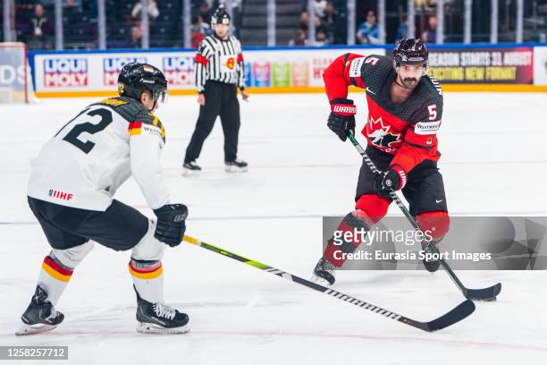 Jacob Middleton of Canada Dominik Kahun of Germany against during the 2023 IIHF Ice Hockey World Championship Finland - Latvia game between Canada...