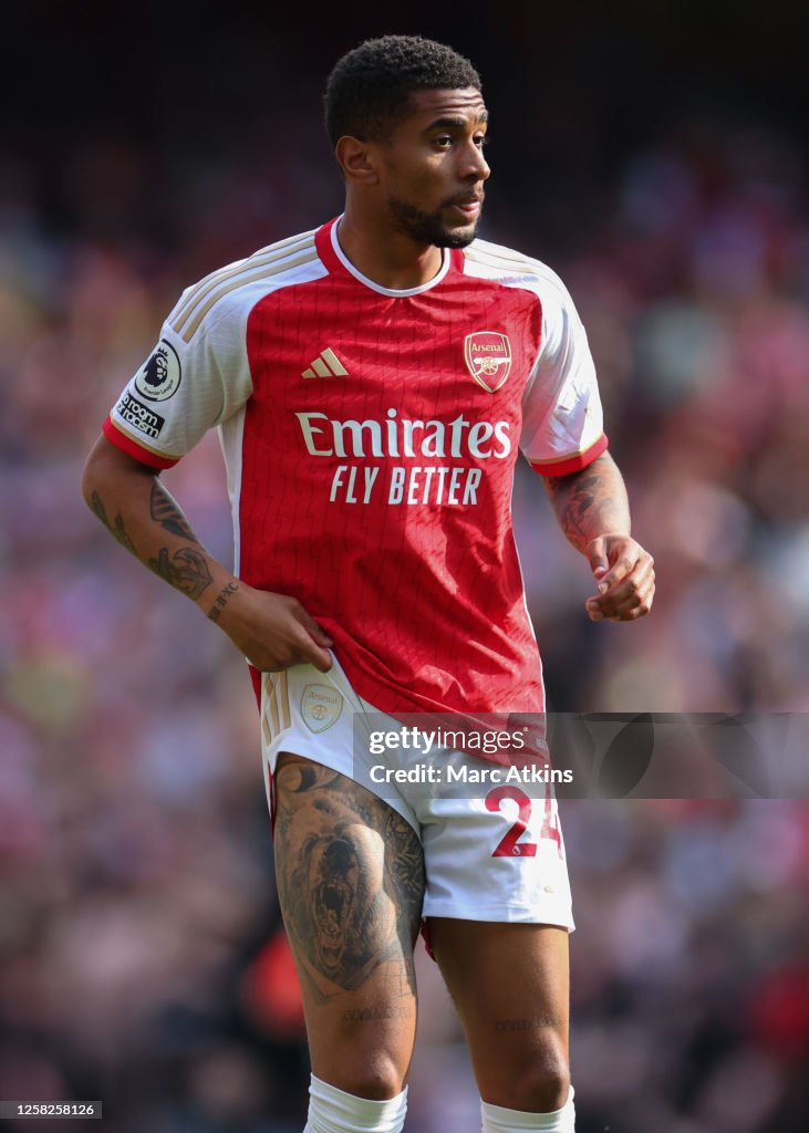 Reiss Nelson of Arsenal shows the tattoo's on his leg during the