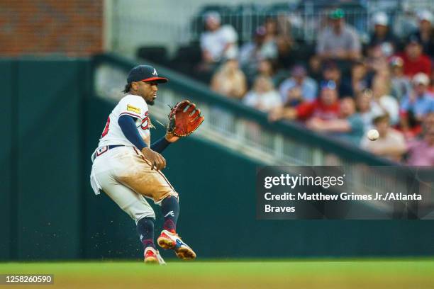 Ozzie Albies of the Atlanta Braves fields a ground ball during the fifth inning during the game against the Philadelphia Phillies at Truist Park on...