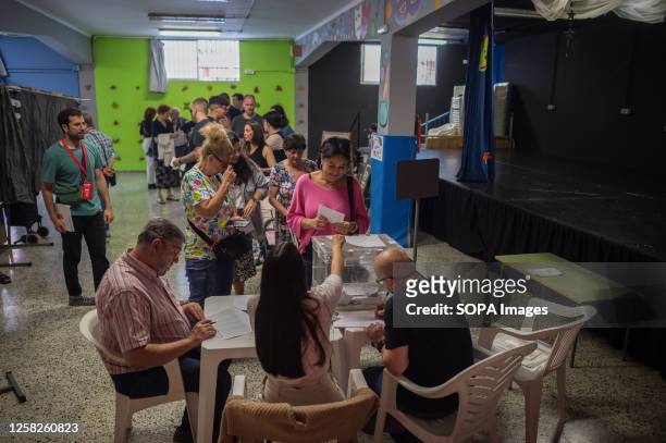 Woman prepares to cast her vote during the municipal and regional elections. Spaniards voted in local and regional elections on May 28 to choose the...