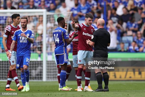 Declan Rice of West Ham United interacts with Match Referee, Simon Hooper during the Premier League match between Leicester City and West Ham United...