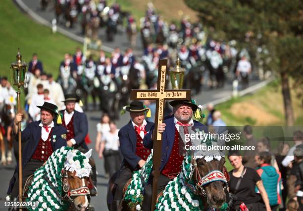 May 2023, Bavaria, Bad Kötzting: Participants of the Kötztinger Pfingstritt ride with their horses on a road. The procession is one of the oldest...