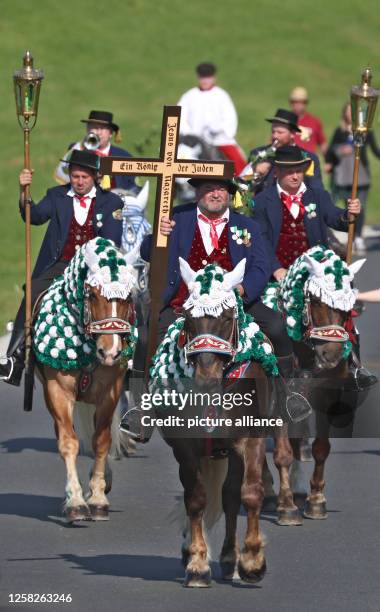 May 2023, Bavaria, Bad Kötzting: Participants of the Kötztinger Pfingstritt ride with their horses on a road. The procession is one of the oldest...