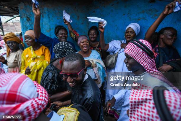 Muslim Nubians wearing traditional clothes celebrate a wedding ceremony with their traditional dance named 'Tari' in front of a tin house at Kibera...