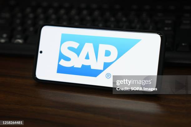 In this photo illustration, the SAP logo is displayed on the screen of a smartphone.