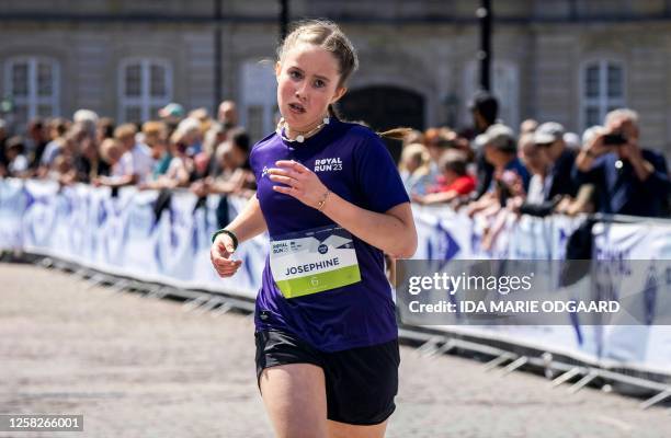 Denmark's Princess Josephine arrives at the finish line at Amalienborg Castle Square after participating in a One Mile Family run during the Royal...