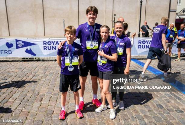 Denmark's Princess Josephine , Princess Isabella, Prince Christian and Prince Vincent pose after running a One Mile Family run during the Royal Run...