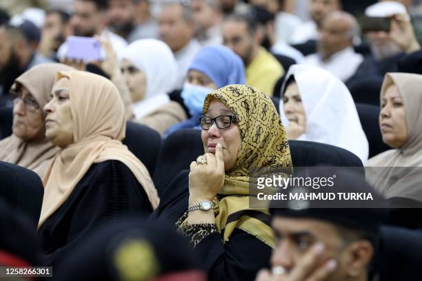 Woman reacts as she attends the trial of jihadists accused of being members of the Islamic State group, in the northwestern Libyan city of Misrata on...