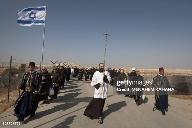 Franciscan priests march from St. John Monastery to the Franciscan Cupola near the Jordan River during a baptism ceremony on October 28, 2010 at the...