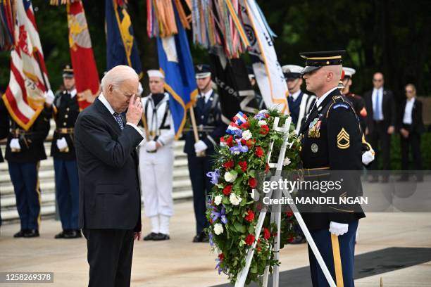 President Joe Biden participates in a wreath-laying ceremony at the Tomb of the Unknown Soldier in Arlington National Cemetery in Arlington,...