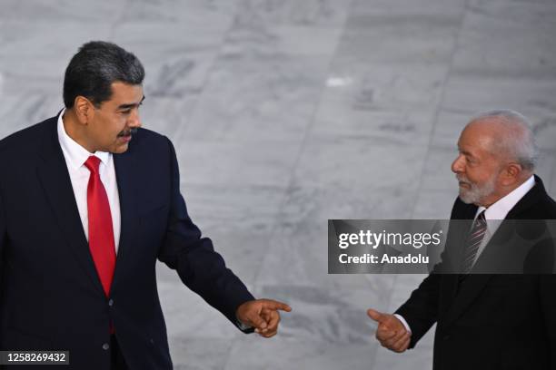 Venezuela's President Nicolas Maduro and Brazil's President Luiz Inacio Lula da Silva talk at Planalto Palace on the day of a summit with presidents...