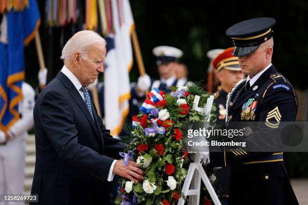 President Joe Biden, left, participates in a wreath laying ceremony at the Tomb of the Unknown Soldier at Arlington National Cemetery on Memorial Day...