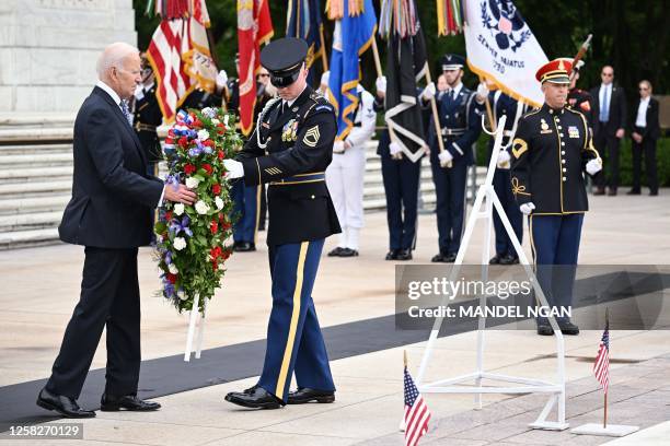 President Joe Biden participates in a wreath-laying ceremony at the Tomb of the Unknown Soldier in Arlington National Cemetery in Arlington,...