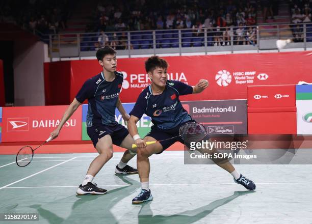 Feng Yan Zhe and Huang Dong Ping of China play against Dechapol Puavaranukroh and Sapsiree Taerattanachai of Thailand during the Mixed Doubles final...