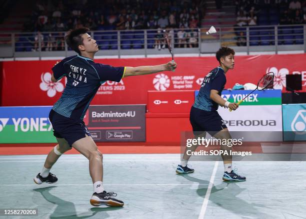 Feng Yan Zhe and Huang Dong Ping of China play against Dechapol Puavaranukroh and Sapsiree Taerattanachai of Thailand during the Mixed Doubles final...