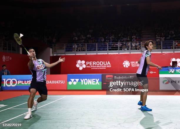 Dechapol Puavaranukroh and Sapsiree Taerattanachai of Thailand play against Feng Yan Zhe and Huang Dong Ping of China during the Mixed Doubles final...