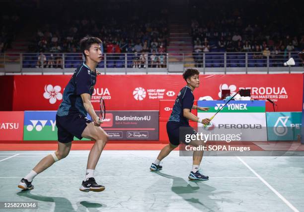 Feng Yan Zhe and Huang Dong Ping of China play against Dechapol Puavaranukroh and Sapsiree Taerattanachai of Thailand during the Mixed Doubles final...