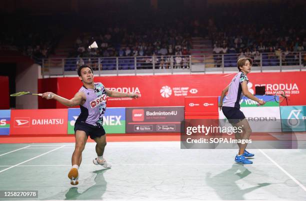 Dechapol Puavaranukroh and Sapsiree Taerattanachai of Thailand play against Feng Yan Zhe and Huang Dong Ping of China during the Mixed Doubles final...