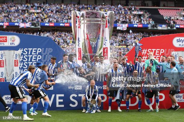 Barry Bannan of Sheffield Wednesday celebrates with the League One Play-off trophy during the Sky Bet League One Play-Off Final between Barnsley and...