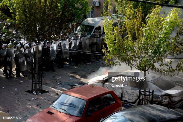 Kosovo riot police and KFOR military police, secure entrance to municipal building in Zvecan, northern Kosovo on May 29 following clashes with Serb...