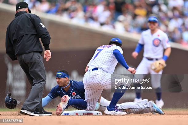 Wander Franco of the Tampa Bay Rays steals second base under the tag of Dansby Swanson of the Chicago Cubs in the seventh inning at Wrigley Field on...