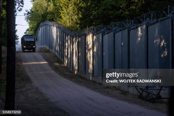 Border guards patrol along the border wall at Polish - Belarus border not far from Bialowieza, eastern Poland, on May 29, 2023.