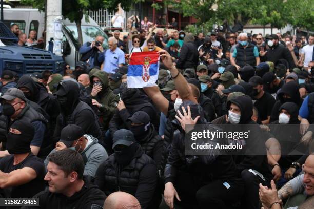 Kosovo Serbs gather outside a municipal building in Zvecan after police helped install ethnic Albanian mayors following controversial elections, on...