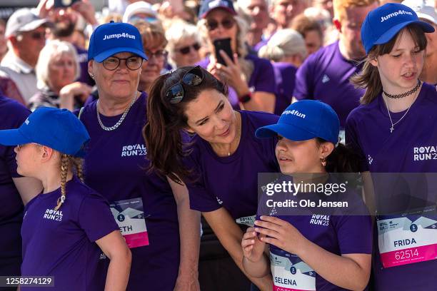 Crown Princess Mary of Denmark with children at the starting line of the starting line of the Royal Run event on a running wheel on May 29, 2023 in...