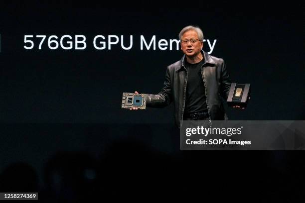 Nvidia president and CEO Jensen Huang speaks at a keynote presentation while holding the Grace Hopper superchip at COMPUTEX. The COMPUTEX 2023 runs...