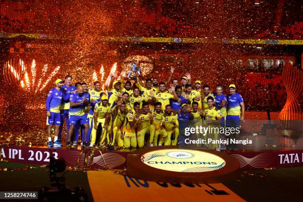 Players of Chennai Super Kings celebrate with the trophy after their victory against the Gujarat Titans in the Indian Premier League Twenty20 final...