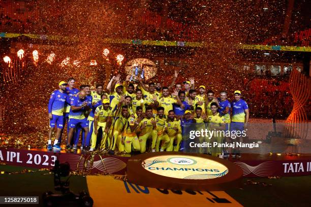 Players of Chennai Super Kings celebrate with the trophy after their victory against the Gujarat Titans in the Indian Premier League Twenty20 final...