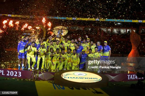 Players of Chennai Super Kings celebrate with the trophy after their victory against the Gujarat Titans in the Indian Premier League Twenty20 final...