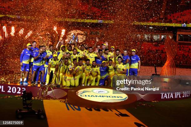 Players of Chennai Super Kings celebrate with the trophy after their victory against the Gujarat Titans in the Indian Premier League Twenty20 final...