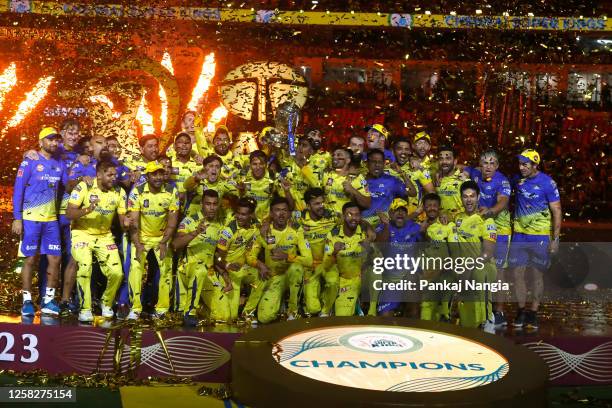 Players of Chennai Super Kings celebrate with the trophy after their victory against the Gujarat Titans in the Indian Premier League Twenty20 final...